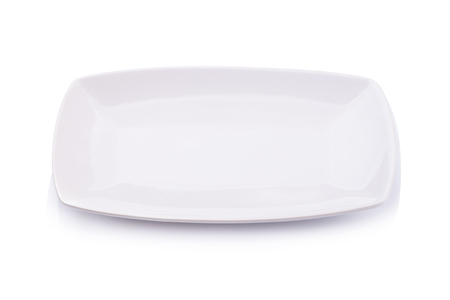 Ceramic white plate on a white background.の写真素材
