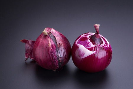 Fresh Red onion on black backgroundの写真素材