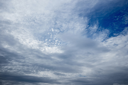 white fluffy clouds in the blue sky.の写真素材