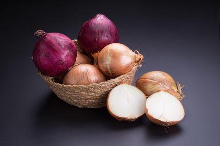 Fresh onion on black backgroundの写真素材