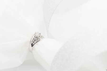 Diamond wedding rings on the white. selective focus.の写真素材