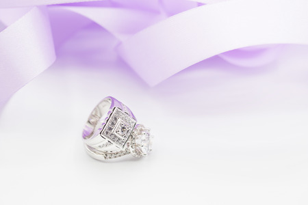 Diamond wedding rings on the white. selective focus.の写真素材