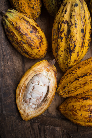 Cacao fruit, raw cacao beans, Cocoa pod on wooden background.の写真素材