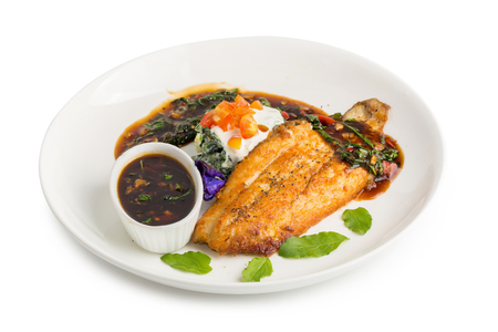 Grilled Salmon steak with garlic and basil herb isolated on white background.の写真素材