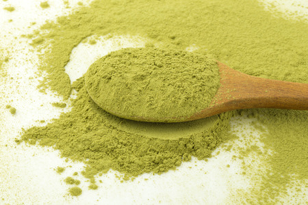 matcha powder green tea isolated on a white background.の写真素材