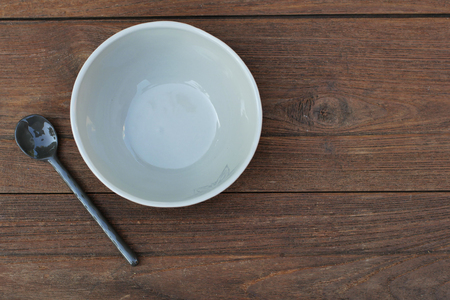 Bowls and Ceramic Spoons on Wooden background.の写真素材