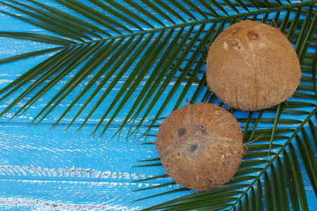 Coconut isolated on the wooden background. Tropical fruit coconut.