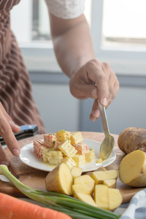 Fresh salad of potatoes with carrot with vegetables.の写真素材