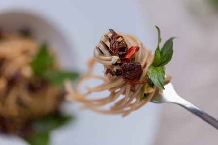 Spaghetti with Thai-style sauce with clams and chilli.の写真素材