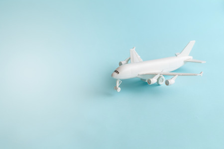 Plastic toy airplane on a Blue sky Backgroundの写真素材
