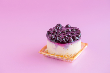 Blueberry cheesecake  on a pink background and copy space.の写真素材