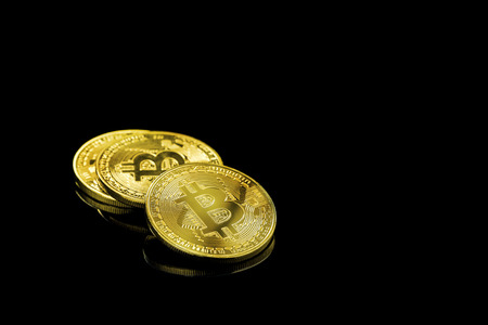 Gold bitcoin physical Bitcoin-Cryptocurrency and Gold nugget grains. Business concept.