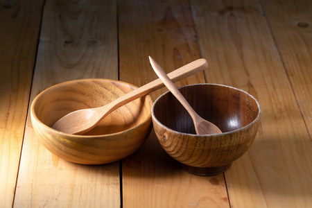 Wooden Tableware Set on a wooden background. の写真素材