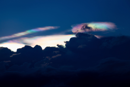 Cloud iridescence, diffraction phenomenon produce very vivid color and make cloud shineの写真素材