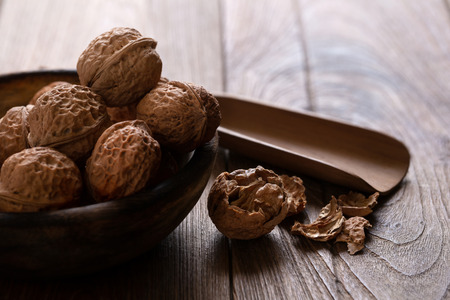 Walnuts kernels in wooden bowl, Walnut healthy food Top view.の写真素材