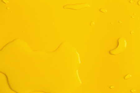 Rain or Water drops on yellow background.の写真素材