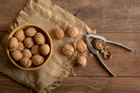 Walnuts kernels in wooden bowl, Walnut healthy food Top view.の写真素材