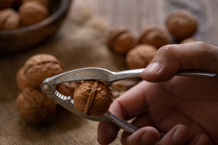 Walnuts kernels in wooden bowl, Walnut healthy food Top view.の写真素材