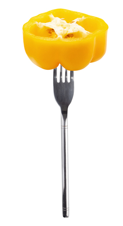 Yellow bell peppers Sliced on a Silver Fork isolated on white background.の写真素材
