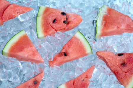 Watermelon Sliced and blueberries on ice tube backgroundの写真素材