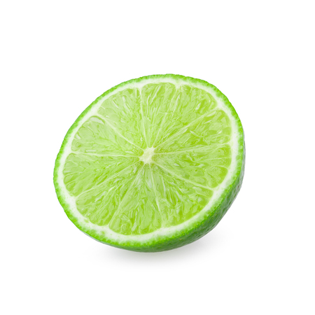 Half with slice of fresh green lime isolated on white background.の写真素材