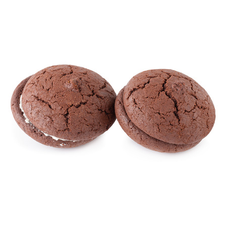 Chocolate cookies and cream on a white plate isolated over white backgroundの写真素材