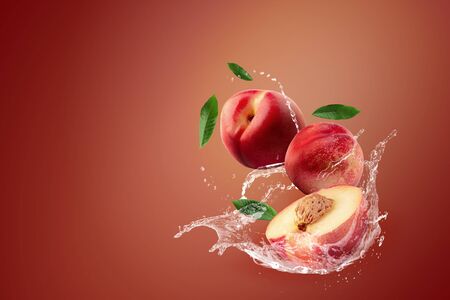 Water splashing on fresh Nectarine fruit over red background.の写真素材