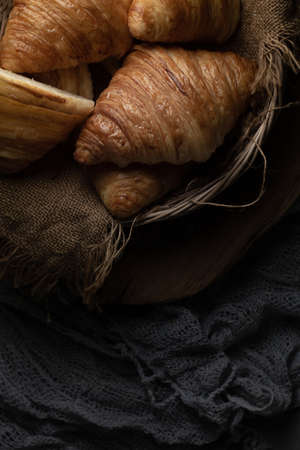 Plain butter croissant crescent pastries, Freshly baked croissants. Warm Fresh Buttery Croissants on a tray.の写真素材