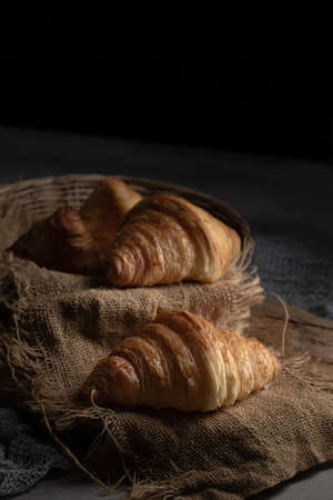 Plain butter croissant crescent pastries, Freshly baked croissants. Warm Fresh Buttery Croissants on a tray.の写真素材