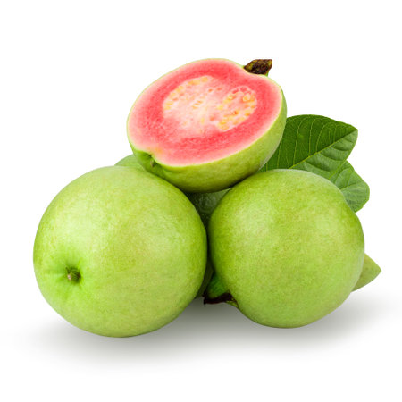Guava is a tropical fruit with pink juicy flesh and a strong sweet aroma with leaf on a white backgroundの写真素材