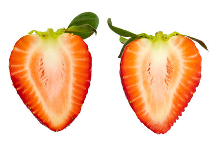 Fresh red strawberries and green leaves on white backgroundの写真素材