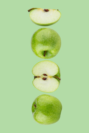 Creative layout made from Green Apple on a Pastel Green background. Fruit minimal conceptの写真素材
