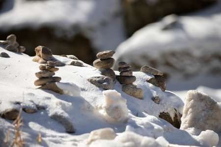 Zen Meditation Background - snow-covered Balanced Stonesの写真素材