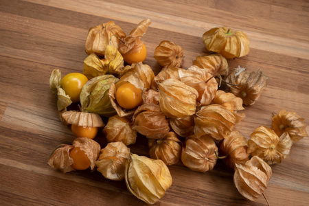 close up Cape Gooseberry top view, Sweet physalis berry on wooden tableの写真素材