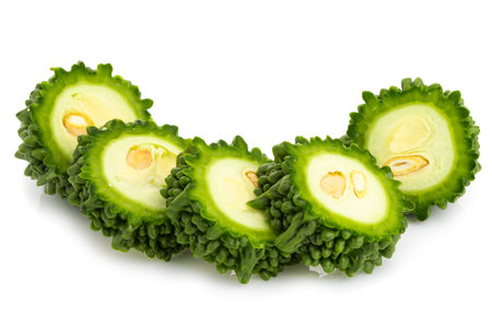Fresh bitter gourd Bitter cucumber or bitter melon with cut slice isolated on a white background.の写真素材
