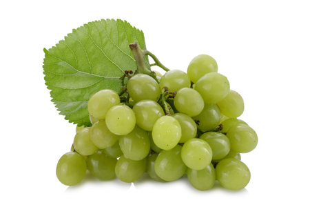 Green grapes and grape leaves isolated on a white backgroundの写真素材