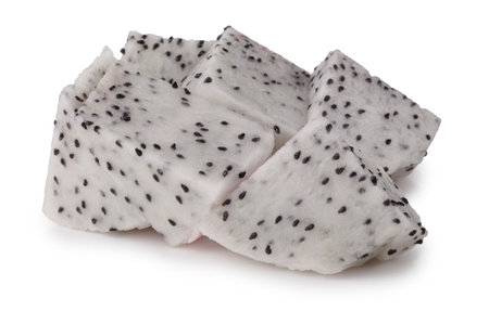 Dragon fruit halves and slices showing juicy flesh on a white backgroundの写真素材