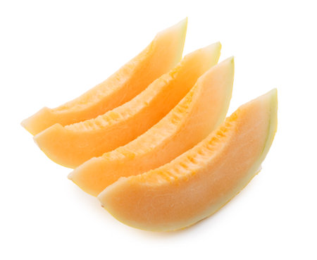 Golden Melon slices isolated on a white backgroundの写真素材
