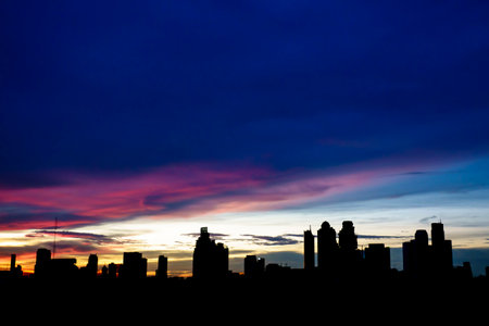 Beautiful sunset sky in Twilight time and silhouette of the cityの写真素材