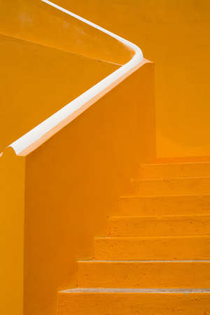 An abstract shot of bright orange stairs in Curacao.の写真素材