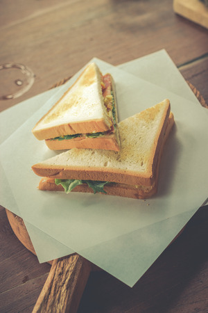 sandwich with bacon and vegetables in vintage styleの写真素材