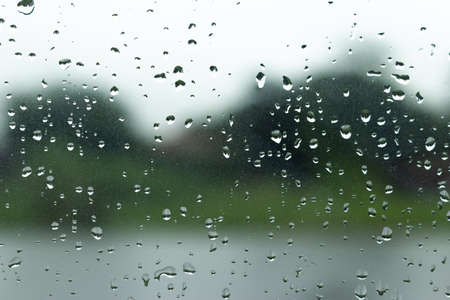 Water drop on glass window background.