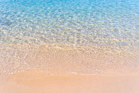 Clear blue transparent tropical summer beach water backgroundの写真素材