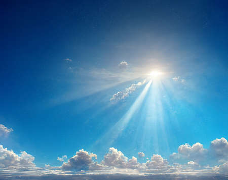 Blue sky with clouds and sun.