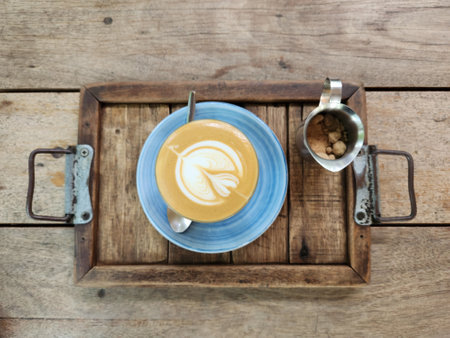 Cup of coffee in top view wooden table background.の写真素材