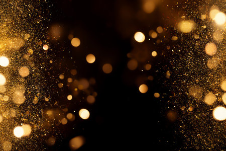 Golden sparkle illuminating an elegant dark space background.の素材
