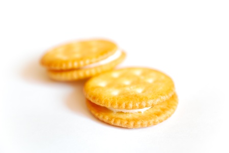 sandwich biscuit with white cream on white backgroundの写真素材