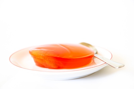 Zalacca in jelly on  saucer with white backgroundの写真素材