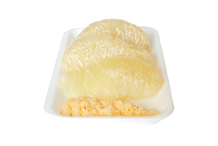 Pomelo citrus on white foam plate の写真素材