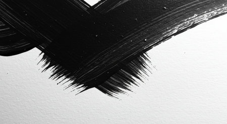 close up of black paint brush stroke on white paper texture background.の写真素材